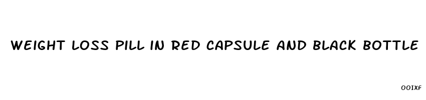 weight loss pill in red capsule and black bottle